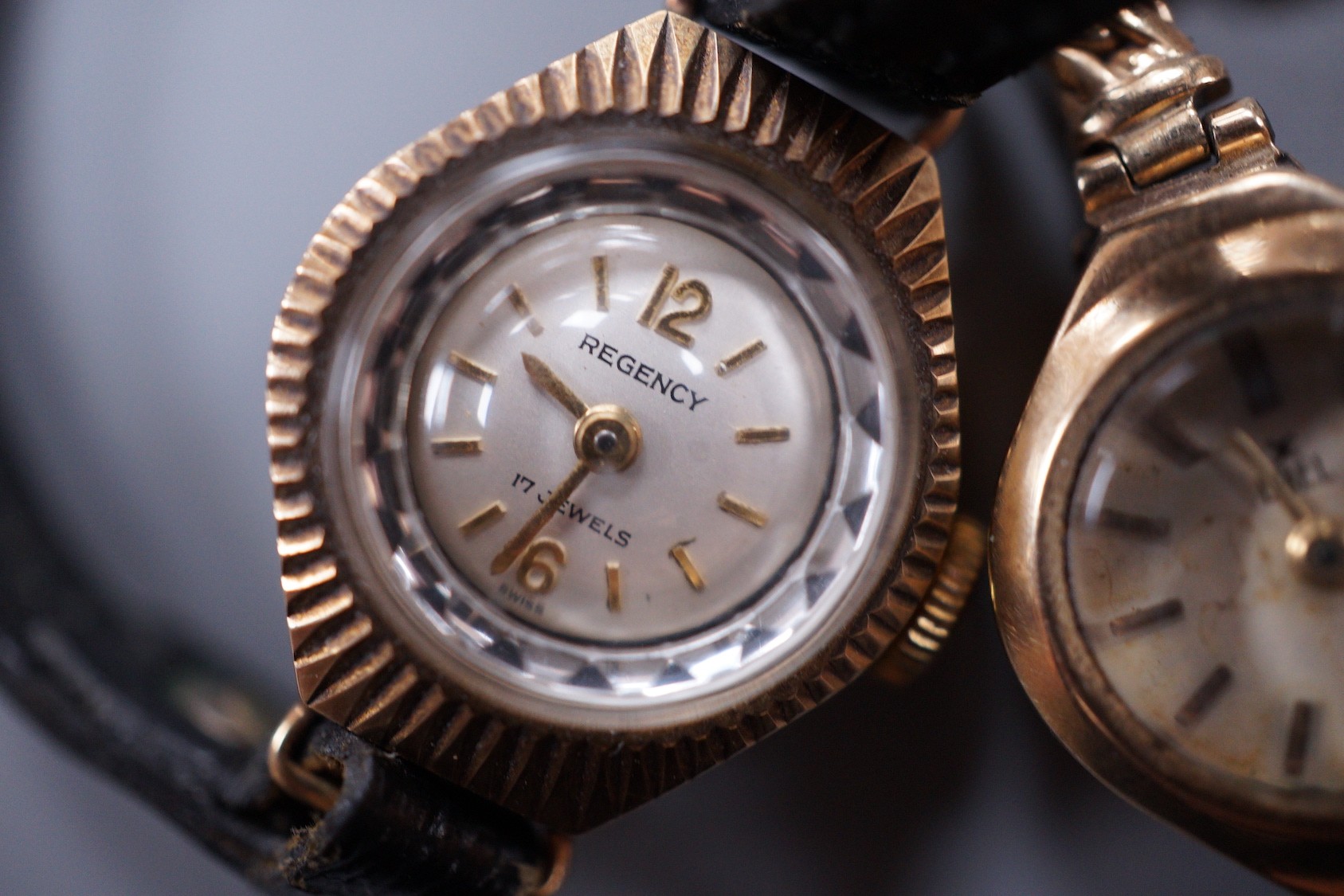 Two lady's 9ct gold manual wind wrist watches, Ebel & Majex, on 9ct bracelets, gross 25.6 grams and a lady's 9ct gold Regency manual wind wrist watch in a leather strap.
